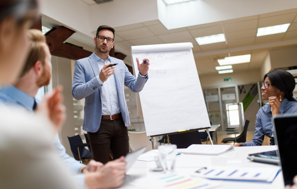 Businessman presenting new project to partners in the office