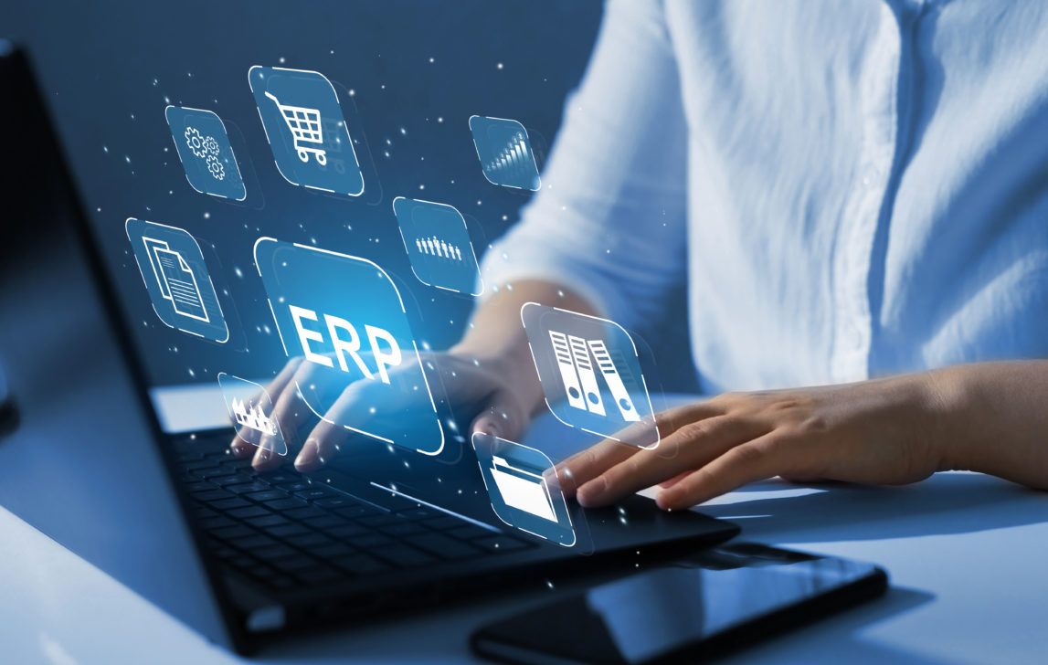Enterprise Resource Planning or ERP concept. Businesswoman working at laptop computer with icons on digital virtual screen.Document management system.