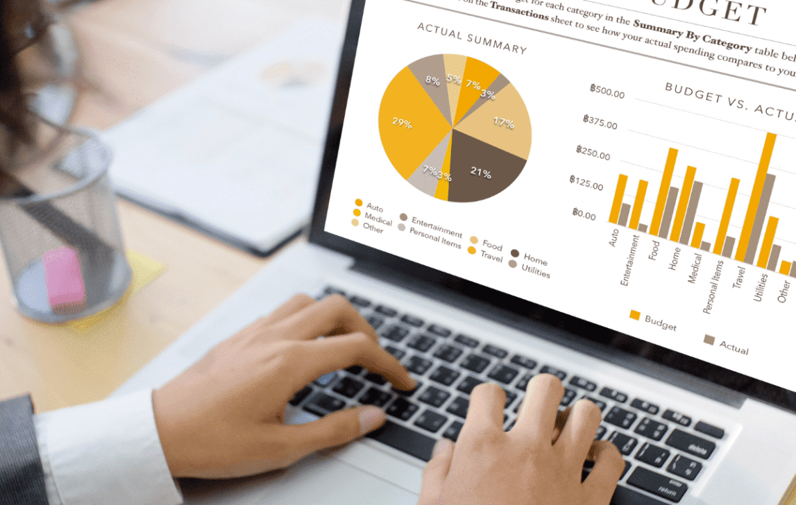 Laptop displaying budget tracking charts and financial reporting, representing real-time project budgeting in NetSuite.
