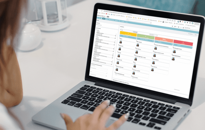 Woman managing sales leads in SuiteCorner Kanban Boards for NetSuite ERP and CRM.